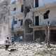 Photo via Getty: Search and rescue team members inspect the debris of buildings after Russian army aircrafts hit residential areas at Sukkari district of Aleppo, Syria on September 07, 2016.